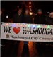 People Holding a We Love Washougal Banner in the Christmas Parade