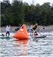 People Participating in a Paddleboard Race