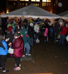 People by White Tents