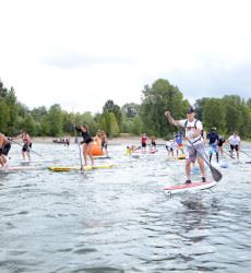 People Racing on Paddleboards